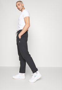 Jordan PANT - Jogginghose - black/white