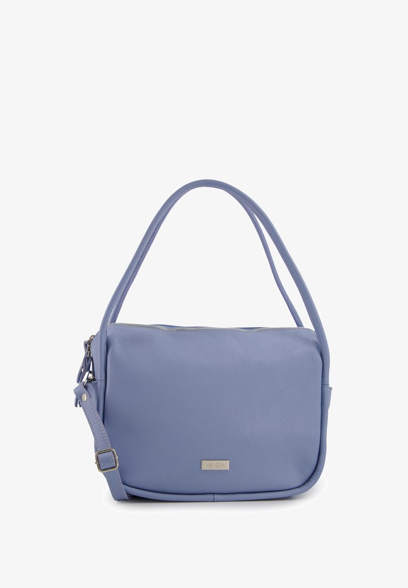 Soft lavender leather handbag with a single shoulder strap, zippered top closure, and a subtle branded metal accent on the front.