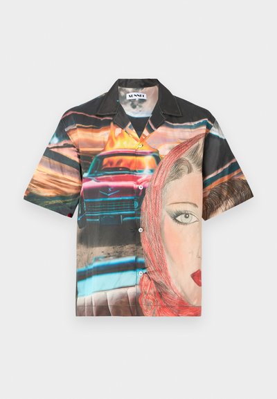 Short-sleeve button-up shirt made of colorful fabric featuring a retro car, a portrait of a woman, and vibrant sunset hues.