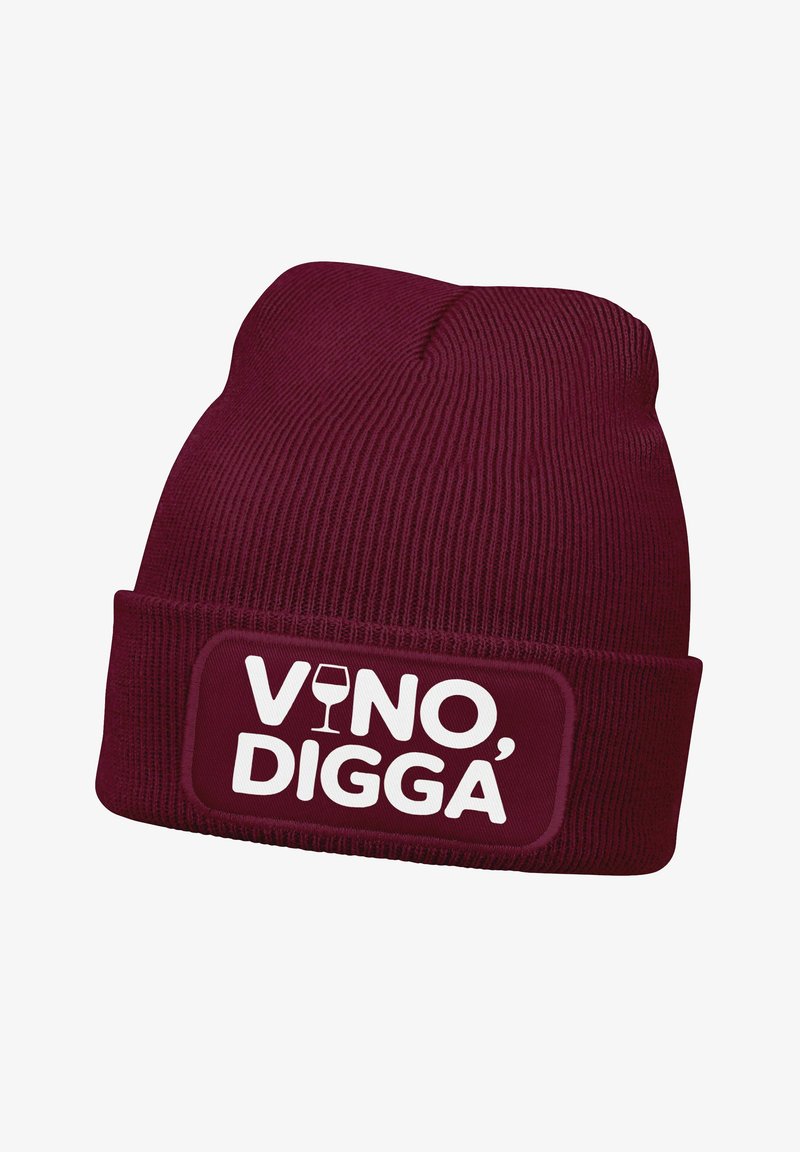 Burgundy knit beanie with a folded cuff. Features a rectangular patch displaying the text "VINO, DIGGA" in white, accompanied by a wine glass icon.