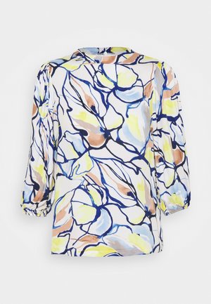 Blouse à manches longues avec motif floral abstrait en bleu, jaune, beige et blanc, avec un col rond haut et des poignets froncés.