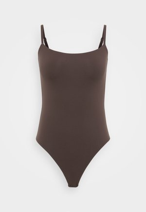 Brown one-piece swimsuit with thin shoulder straps, a smooth texture, and a high-cut leg design, featuring minimalistic, seamless construction.