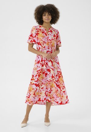 Rochie florală de lungime medie, cu mâneci scurte, având o paletă de culori roșu, roz și portocaliu. Talie elastica și decolteu în formă de V.