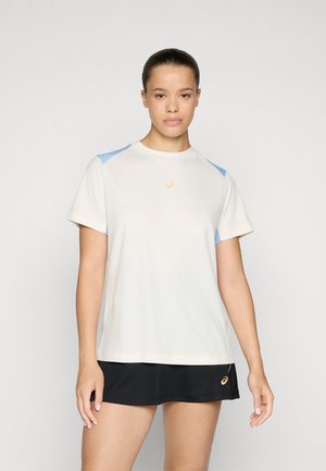 Short-sleeve sports t-shirt in light cream with blue accents on shoulders, made from a smooth, breathable fabric, featuring a small logo.