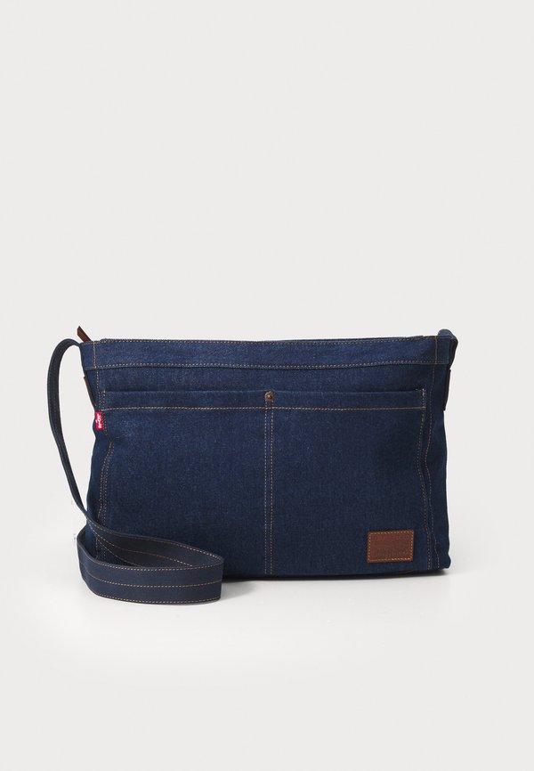 HERITAGE MESSENGER UNISEX - Cross body bag - indigo rinse