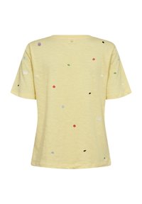 Chemise à manches courtes jaune clair avec de petits points brodés colorés dispersés en rouge, vert, blanc, noir, bleu et violet.