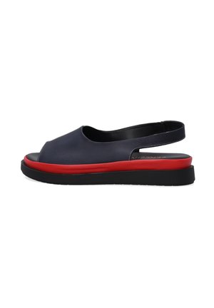 Navy leather slingback sandal with an open toe, red midsole, and black rubber sole. Features a smooth texture and minimalist design.