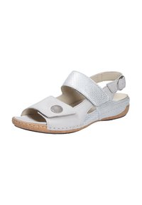 White sandal with a silver metallic strap, open toe, adjustable buckle, and cork sole. Features a textured upper and round decorative detail.