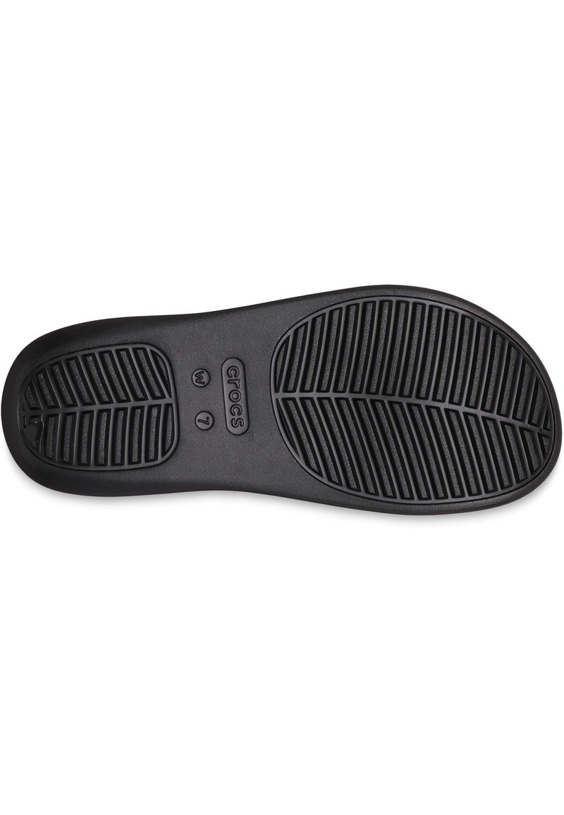 Suola di Crocs neri con un motivo di grip testurizzato, taglia 7, caratterizzata da scanalature orizzontali e diagonali per una migliore aderenza.