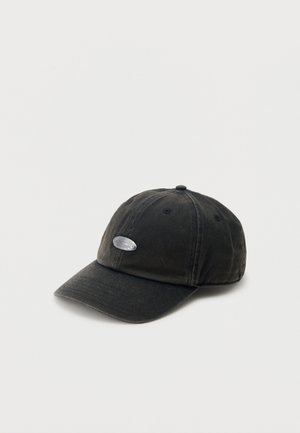 Black baseball cap with curved brim and small oval silver emblem on front, set against a plain light background.
