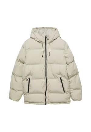 Beige színű puffertarka dzseki kapucnival, cipzáras elülső zárással, rugalmas húzózsinórral, két oldalsó cipzáras zsebbel és tűzött mintázattal a hőszigetelés érdekében.