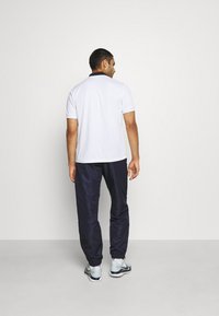 Sergio Tacchini CARSON - Calças de fato de treino - dark blue/white