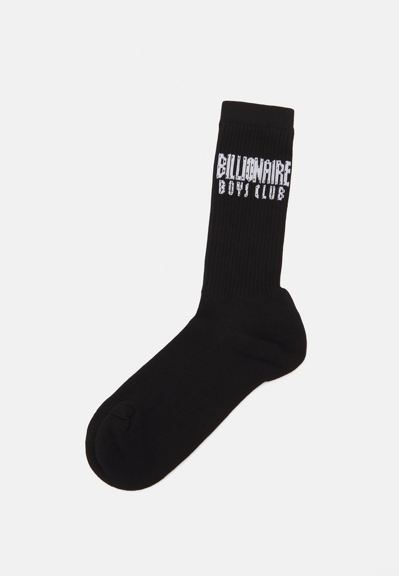 Melnas kokvilnas zeķes ar ribota tekstūra un baltu "Billionaire Boys Club" logotipu, kas drukāts sānos. Klasiska pilna garuma dizains.