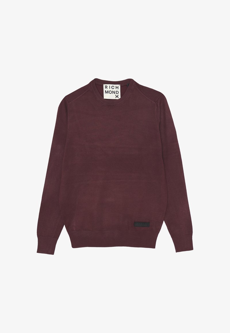 Maglione bordeaux con collo rotondo, maniche lunghe, polsini e fondo a coste. Presenta un'etichetta nera nella parte inferiore con il nome del marchio.