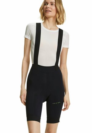 Zwarte fietsshorts met verstelbare bandjes, voorzien van een gepolsterd zitvlak en groene letters "FALKE." Materiaal lijkt rekbaar met een gladde textuur.