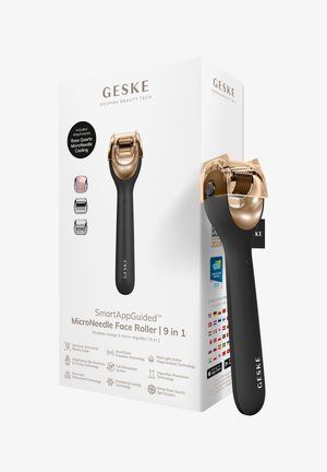 Roulette pour le visage avec poignée noire et tête microneedle en or rose, présentée à côté d’un emballage blanc listant les accessoires inclus et les caractéristiques techniques.