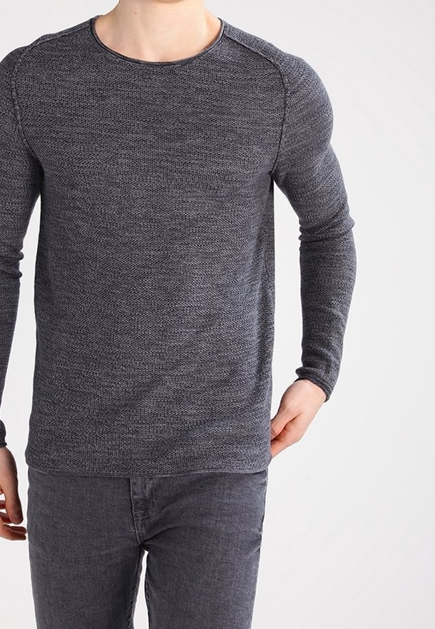 Long-sleeve, crew neck shirt in dark gray textured knit. Features ribbed detailing at cuffs and shoulder seams. Paired with dark gray jeans.