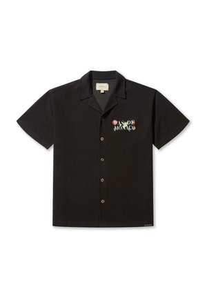 Camisa de botones de manga corta negra, hecha de un tejido ligero, con el texto bordado "PAS DE MONACO" en letras florales coloridas.