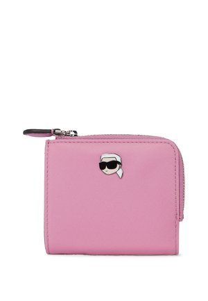 Pink zippered wallet made of textured material, featuring a small cartoon character with sunglasses as an accent on the front.