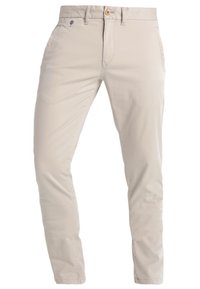 Béžové bavlněné chinos kalhoty se slim fit střih, s předními kapsami, knoflíkovým zapínáním a jemnými švy na pase.