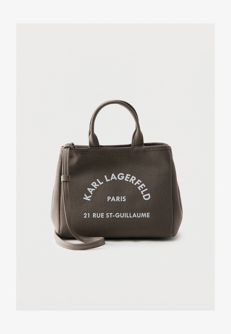 Тъмнокафява платнена чанта Karl Lagerfeld Paris с къси дръжки, дълга презрамка и бял надпис отпред.