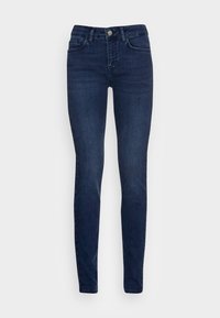 Jeans ajustados en denim azul oscuro, con cinco bolsillos, un cierre de botón y detalles de costura sutiles, con un acabado suave y ligeramente texturizado.