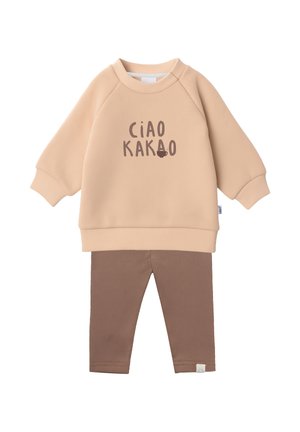 Beige langärmliges Sweatshirt mit dem Text "CIAO KAKAO" und einer kleinen Tassen-Grafik, kombiniert mit braunen, gerippten Leggings für Kleinkinder.