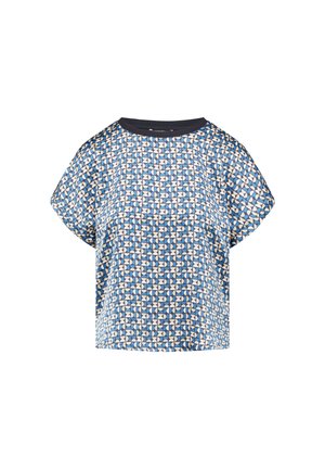 Short-sleeve blue top featuring a geometric pattern in cream and light blue, with a solid dark blue neckline and relaxed fit.