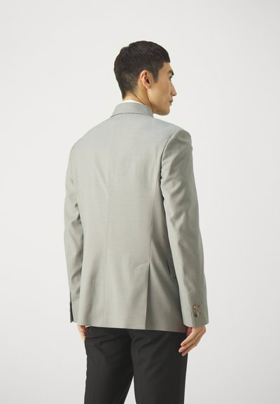 Light grey blazer with a tailored fit, two back vents, and gold-tone button accents on the sleeves. Fabric appears smooth and structured.