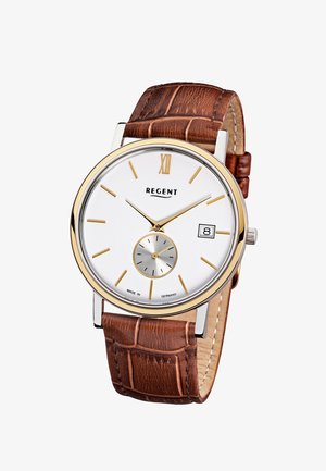 Montre classique avec cadran blanc, index dorés, guichet de date à 3 heures, petit cadran des secondes, et bracelet en cuir marron.
