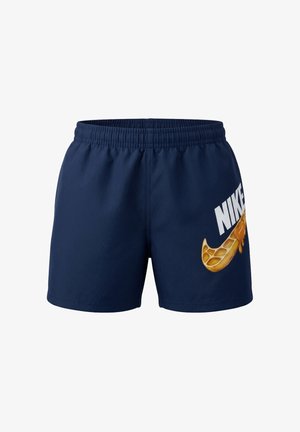 Pantalones cortos azul marino con cintura elástica que presentan un diseño de panal goteando formando el logo de Nike y el texto "NIKE" en la pierna derecha.