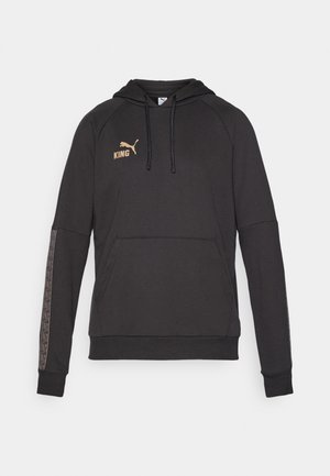 Fekete kapucnis pulóver, kenguru zsebbe építve, arany "KING" logóval és mintás díszítéssel az ujjak mentén. Puha anyag.