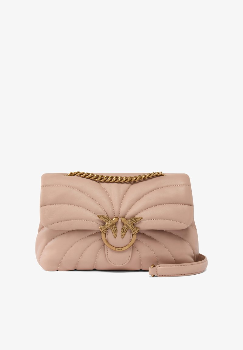 Quilted blush leather handbag with a gold chain strap, featuring a decorative ring accent with bird motifs. Compact design with a smooth texture.