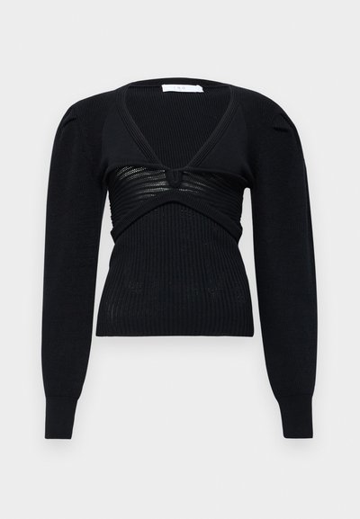Svart langermet genser med dyp V-hals, med ribbestruktur og samlet frontdetalj. Laget av tykk strikket materiale.