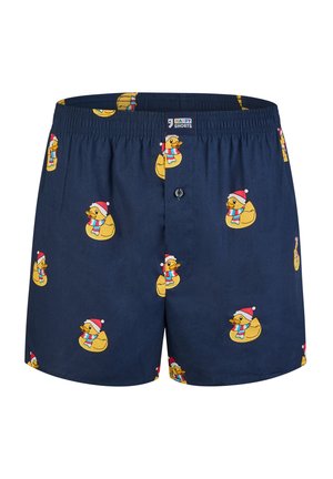 Marineblauwe boxers gemaakt van ademende stof, met een herhaalpatroon van cartoon eenden die Santa-hats en kleurrijke sjaals dragen.