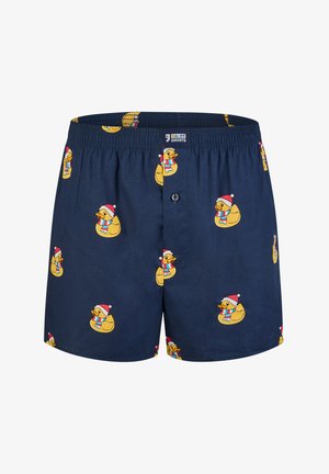 Marineblauwe boxers gemaakt van ademende stof, met een herhaalpatroon van cartoon eenden die Santa-hats en kleurrijke sjaals dragen.