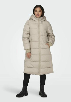 Light beige puffer coat with a hood, featuring a zip front, ribbed cuffs, and side pockets. Mid-length, quilted design with a smooth finish.