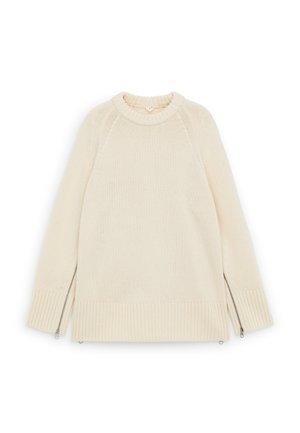 Cream-colored knit sweater with ribbed cuffs and hem, featuring silver zippers running up the outer sides of both sleeves.