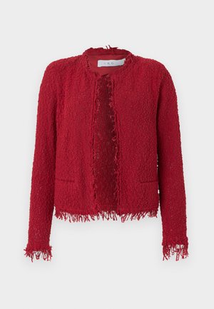 Veste rouge texturée avec un ourlet à franges, devant ouvert, col rond et deux poches sur le devant. Fabriquée en tissu tissé avec une coupe ample.