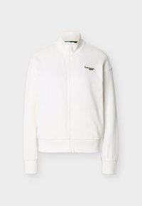 Λευκό μπουφάν με φερμουάρ και ψηλό γιακά, μακριά μανίκια, ριμπ μανσέτες και μικρό πράσινο λογότυπο Lacoste στο αριστερό στήθος.