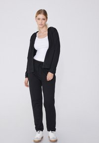 Tezenis MIT PASPELTASCHEN UND TUNNELZUG - Pantalon de survêtement - nero