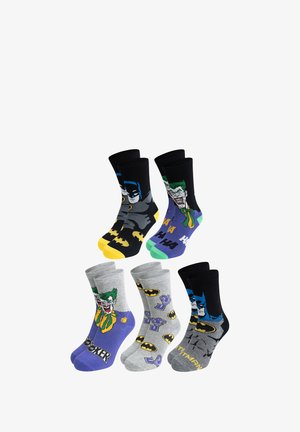 Set di sei paia di calze con design di Batman e Joker. Materiali: misto cotone. Colori: nero, grigio, viola e giallo. I motivi includono loghi e grafiche.