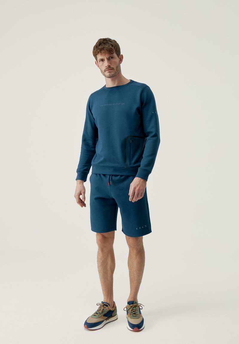 Born Living Yoga Korte broeken blauw Born Living Yoga Korte broeken blauw