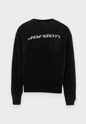 Czarny, puszysty sweter z okrągłym dekoltem i ściągaczami na rękawach. Na przodzie znajduje się szare logo "Jordan". Miękka faktura i luźny krój.