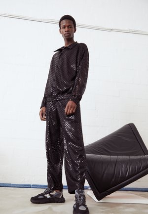 TRANSPARENT TRACKPANTS - Trousers - black