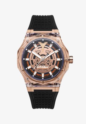 Rose gold and black wristwatch with geometric dial, white hour markers, luminous hands, black textured silicone strap, and brand logo on face.