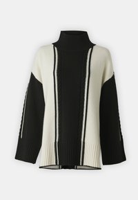 Maglione a collo alto lavorato a maglia in bianco e nero, caratterizzato da righe verticali e dettagli a treccia. Vestibilità ampia con polsini e orlo a coste.