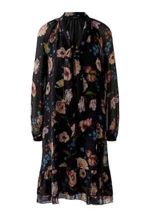 Robe noire à fleurs arrivant aux genoux, avec manches longues en voile transparent, ourlet à volants et détail noué au col, ornée de fleurs roses, bleues et jaunes.