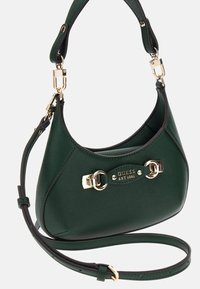 Sac à main en simili cuir vert avec quincaillerie dorée, en forme ovale, avec une poignée supérieure et une bandoulière amovible. Logo de la marque embossé à l'avant.