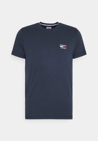 Námořnická modrá krátká rukávová tričko s kulatým výstřihem s malým bílým a červeným logem "Tommy Jeans" na levé hrudi.